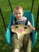 JJ sitting in his swing.