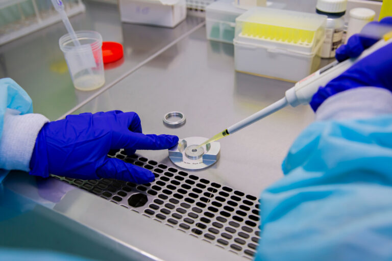 Semen sample being analyzed under a microscope in a fertility lab